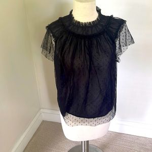 Sheer black blouse with polka dots